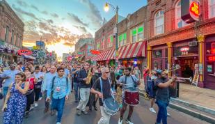 Conference and band marching on Beale Street