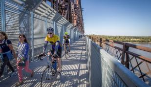 Bikers going across Big River Crossing