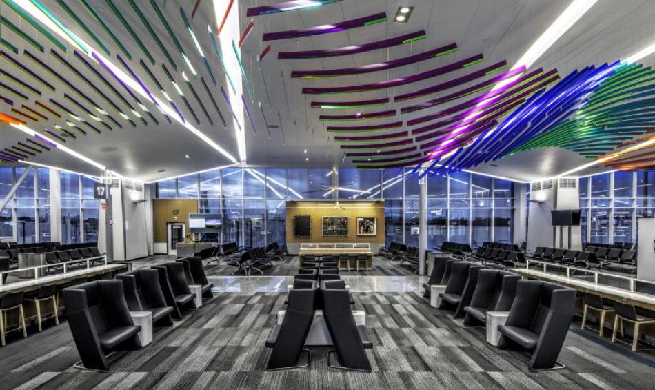 An image of the passenger seating area under a flowing piece of public art at the new Concourse B inside Memphis International Airport | Steve Austell
